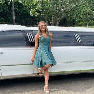 Juliet teal colored, sparkly dress, size Small. Has pockets for convenience.